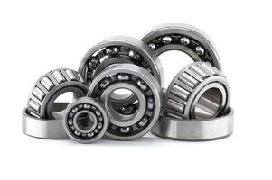 Assortment of various bearings isolated on a clean white backdrop, close up details. photo