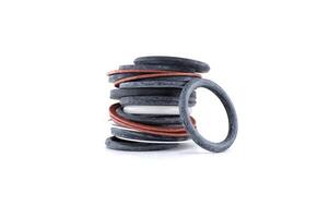 A detailed shot of a stack of assorted o-rings, showcasing mechanical parts and components. photo