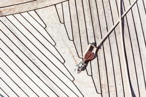 Boat deck with wooden texture and rope detail, abstract pattern background photo
