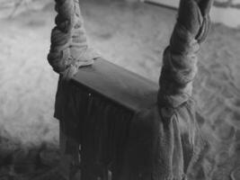 A lonely swing set in an abandoned playground, evoking nostalgia and desolation photo