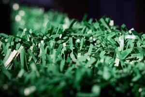 Vibrant and EyeCatching Green Shredded Paper Ideal for Various Crafts and Decorations Projects photo