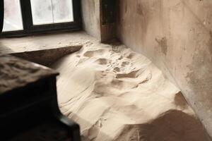 An Abandoned Room with Sand, showing the intersection of time and neglect, awaits exploration photo