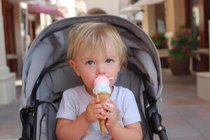 A young child eating an ice cream cone in a stroller photo