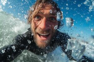 A man is smiling while riding a wave photo