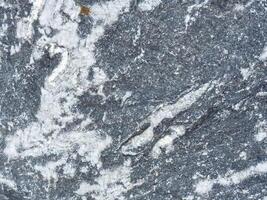 Close-up of marble stone texture with gray and white patterns photo