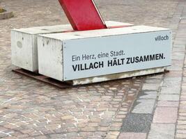 Villach sculpture base on cobblestone with heartfelt message photo