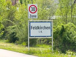 Feldkirchen i.k. 30 zone sign in lush greenery photo