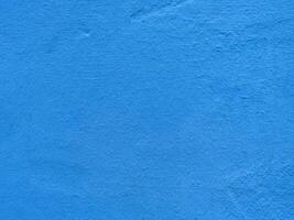Textured vibrant blue wall surface with subtle patterns photo