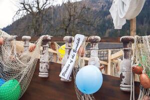 Decorative pirate ship with nets and balloons at outdoor event photo