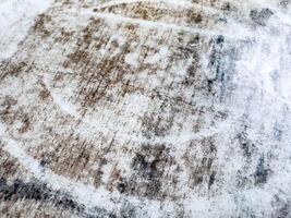 Abstract textured surface with brown and white patterns photo