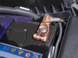 Copper battery terminal of a car close-up photo