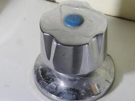 blue cold water old cromated faucet on ceramic washbasin photo