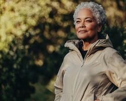 An older woman wearing a jacket and pants photo