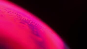 Red reflections of liquid in macro, red liquid surface, bubbles in macro, connection of bubbles in macro, cell from liquid, glossy smooth motion video