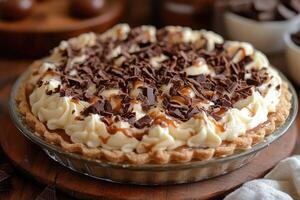 A pie with chocolate and cream on top photo