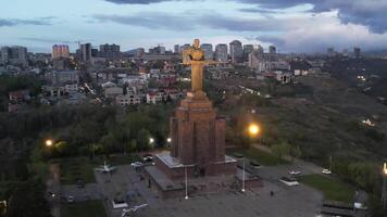 Yerevan, Armenia. Aerial eveningview of the Mother Armenia statue illuminated in Victory Park against the backdrop of the city lights. video