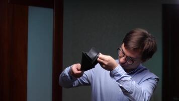 Office worker checking empty wallet experiencing financial problems video