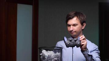 Office worker throwing gamepad into trash can video