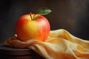 A red apple on a yellow cloth photo