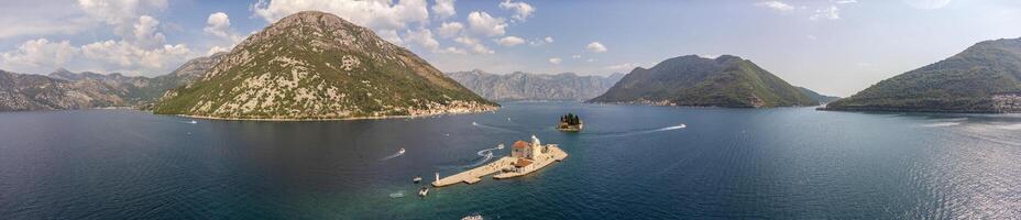 Aerial panorama of the island with the church of our lady of the rocks centered in the image. Tourist attraction in summer near Perast in the Bay of Kotor, Montenegro photo