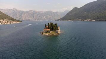 Aerial view of St. George Island surrounded by sea. Tourist attraction of the ancient monastery on the island near Perast, in the Bay of Kotor, Montenegro photo