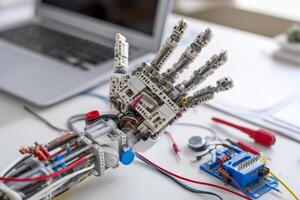 Robot hand model in classroom or tech lab setup photo