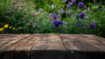 A wooden table in a field of flowers photo
