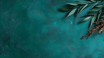 Green leaves and branches on a blue background photo