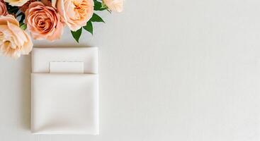 Elegant Table Setting with Peach Roses and Blank Card photo