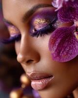 Model showing purple and gold makeup with orchid decoration photo