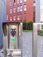 Modern intercom system at gated entrance photo