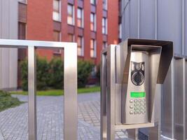 Keypad intercom at residential gate photo
