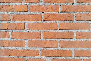 Evenly Laid Red Brick Wall with Gray Mortar photo