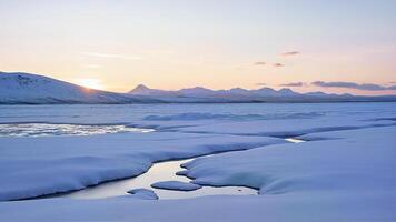 Aerial View of Snowy Mountain at early Sunrise photo