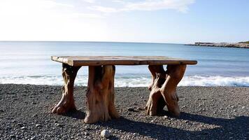 Rustic Wooden Table Overlooking Peaceful Seaside View photo