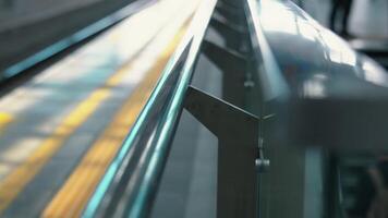 Child Walking by a Shiny Railing in a Modern Space video