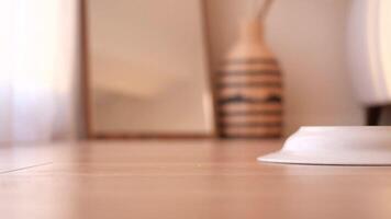a slice of pizza and plate dropped on a wooden floor video