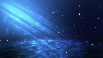 Glowing blue particles on a blue background with a ray of light at the top. Animation of the underwater bottom with light and particles breaking through video