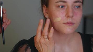 The brush dances over the eyelids, layering soft pigment. The model keeps her eyes closed in calm focus. A dreamy gaze takes shape video