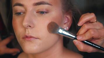 Lip balm is smoothed on before color. The surface softens instantly. Preparation is part of the ritual video