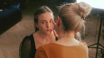 Light foundation is spread with a sponge. Texture melts into the skin. Natural finish appears weightless video