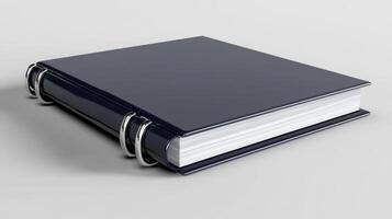 A blue book with a white cover on a white surface photo