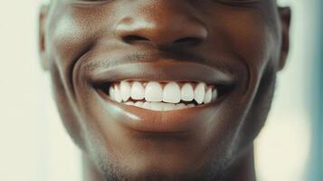 A Closeup Portrait of a Man's Bright, Radiant Smile Showcasing Healthy Teeth and Glowing Skin photo