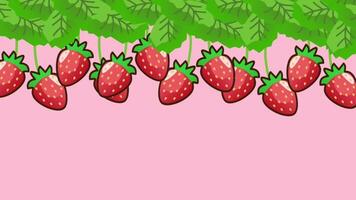 Strawberries hang in abundance from green vines, creating a lively and fresh display against a soft pink background video