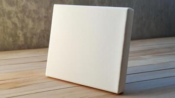 Blank White Canvas on Wooden Surface Ready for Artwork or Design Project photo