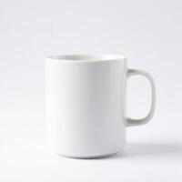 A white mug on a plain surface photo