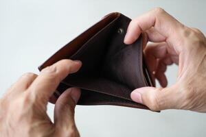 A person holding an empty wallet photo