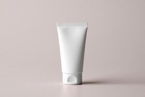 A tube of white cream on a light background photo