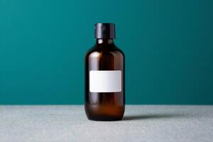 A brown bottle with a white label on a table photo