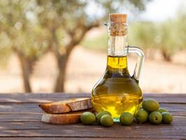 Olive oil and bread on a wooden table photo